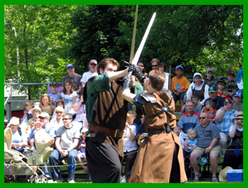 An outlaw battles a guard in the tournament